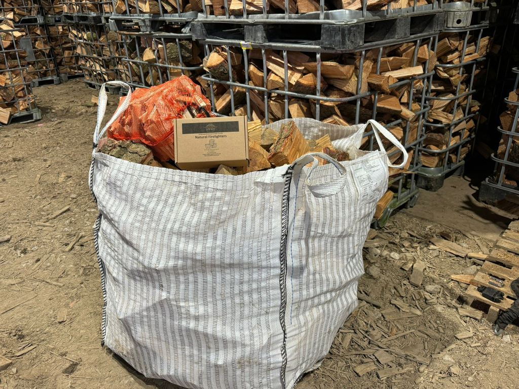 A Large Bulk Bag of Mixed Firewood, a Bag of Kindling and a Box of Firelighters